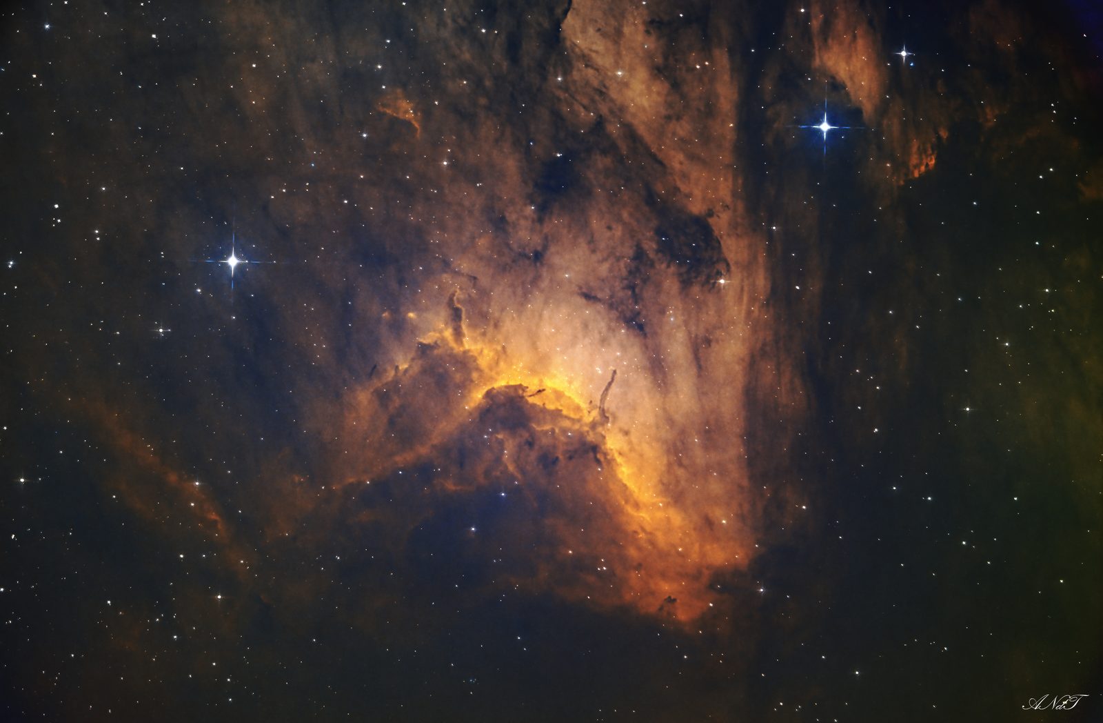 Pelican Nebula, IC 5070: golden gas front and dark dust among stars